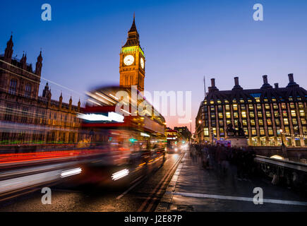 Red double decker bus in front of Big Ben, dusk, evening light, sunset, Houses of Parliament, Westminster Bridge Stock Photo