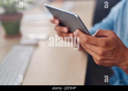 Designer using a tablet at his desk in an office Stock Photo