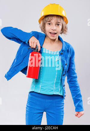 Girl wearing yellow hard hat Stock Photo