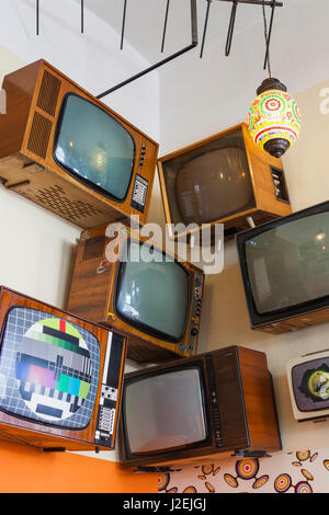 Romania, Crisana Region, Oradea, Lactobar, retro bistro restaurant, display of Soviet era televisions Stock Photo