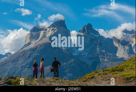 Tourists watching over the horns of the Paine massive with the use of Bokeh inside the Torres del Paine national park in Patagonia, Chile. Stock Photo