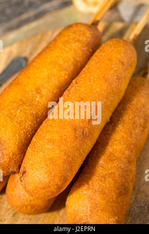 Homemade Deep Fried Corn Dogs with Mustard and Ketchup Stock Photo