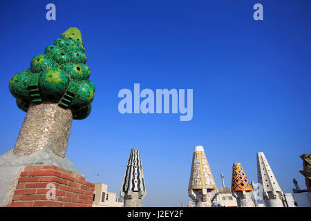 A precursor to Casa Mila, Palau Guell is also famous for its unusually shaped chimneys, designed by Antoni Gaudi in Barcelona, Spain. Stock Photo