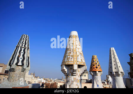 A precursor to Casa Mila, Palau Guell is also famous for its unusually shaped chimneys, designed by Antoni Gaudi in Barcelona, Spain. Stock Photo