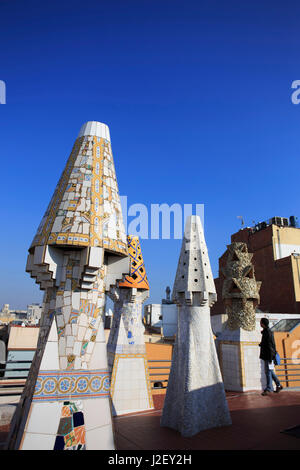 A precursor to Casa Mila, Palau Guell is also famous for its unusually shaped chimneys, designed by Antoni Gaudi in Barcelona, Spain. Stock Photo