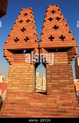 A precursor to Casa Mila, Palau Guell is also famous for its unusually shaped chimneys, designed by Antoni Gaudi in Barcelona, Spain. Stock Photo