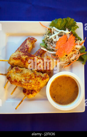 Chicken Satay Plate of food at Restaurant in Choeng Mon, Ko samui, thaialnd Stock Photo