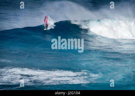 USA, Hawaii, Maui. Robby Naish windsurfing monster waves at Pe'ahi Jaws, North Shore Maui. Stock Photo