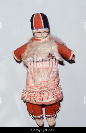 Native American Athabaskan artifact of a doll in traditional clothing that shows Russian influence. Alaska Stock Photo