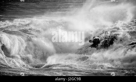 Black and white: Rough seas captured in Hondoq ir Rummien, Gozo during the stormy weekend of the 18th of December, 2016. Stock Photo