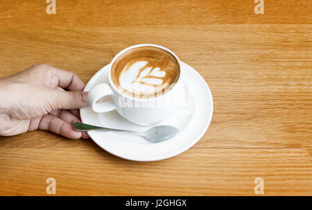 latte art coffee on wood table and copy space background Stock Photo