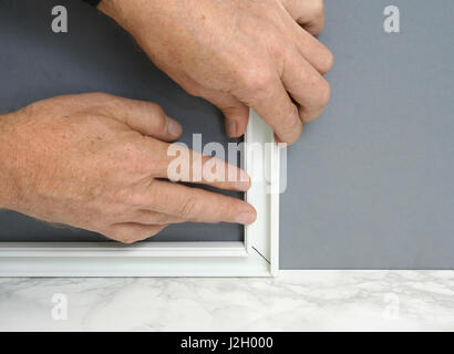 Installing a power outlet with surface mount electric wiring channel