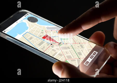 close up of hand with gps map on smartphone Stock Photo
