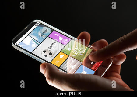 close up of hand with apps on smartphone Stock Photo