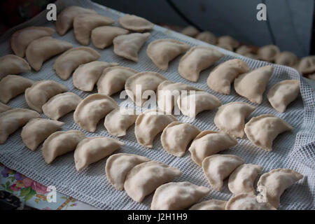 Vareniki dumplings , pierogi before boiling - traditional Ukrainian food Stock Photo