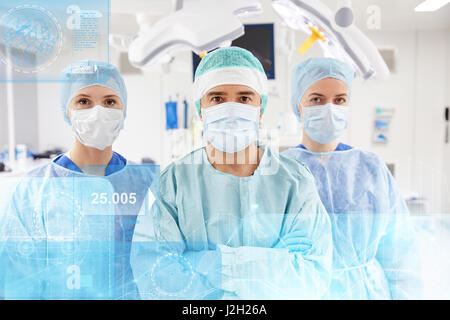 group of surgeons in operating room at hospital Stock Photo