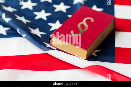 close up of american flag and lawbook Stock Photo
