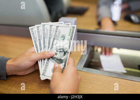hands with money at bank office or exchanger Stock Photo