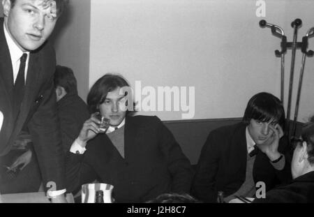 Members of the British rock band The Kinks, Dave Davies and Mick Avory, enjoying a drink in a Parisian bar.  February 23, 1965 Photo André Crudo