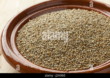 Dish with dried pearl millet close up Stock Photo