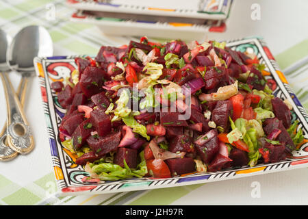 Modern designed dish with Moroccan beet salad close up Stock Photo