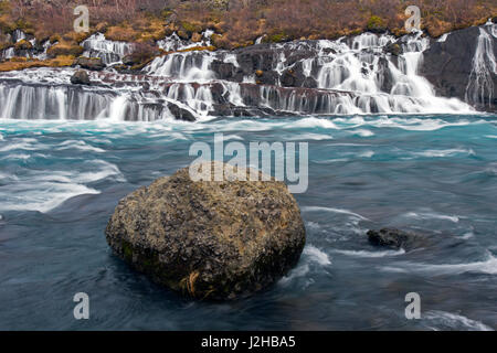 Hraunfossar, series of waterfalls pouring into the Hvítá river in winter, Vesturland, Borgarfjörður, western Iceland Stock Photo