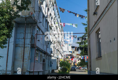 Clothes drying in traditional way on the street of Batumi, Georgia. September Stock Photo