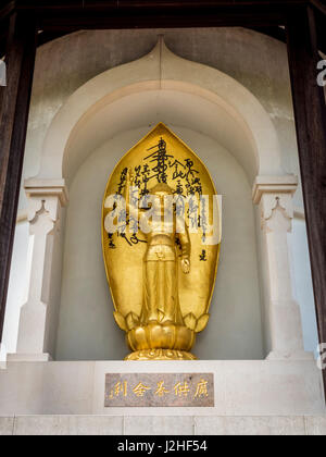Gold Buddha sculpture on the Peace Pagoda, Battersea Park, London, UK. Stock Photo
