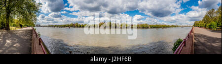 Panorama of River Thames showing North bank, Chelsea Bridge and Albert Bridge from Battersea Park, Wandsworth, London, UK. Stock Photo