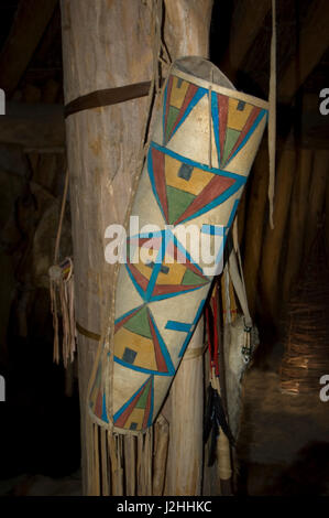 Dried rawhide was used to make parfleche items such as this painted quiver which a Mandan hunter used to carry his arrows. Stock Photo