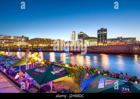 Beach bar Capital Beach at dusk at the river Spree opposite central railway station, Berlin-Mitte, Berlin, Germany Stock Photo