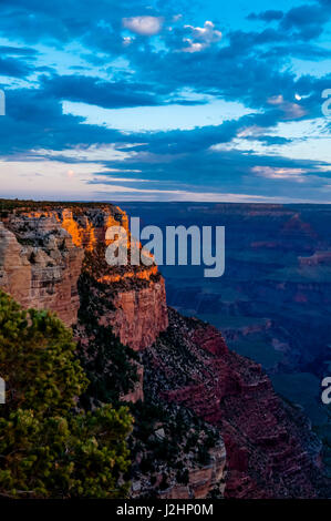 Grand Canyon, Arizona, at sunrise, view from the south rim, amazing cloudscape as rays of light burst through clouds and provide for vivid colors Stock Photo