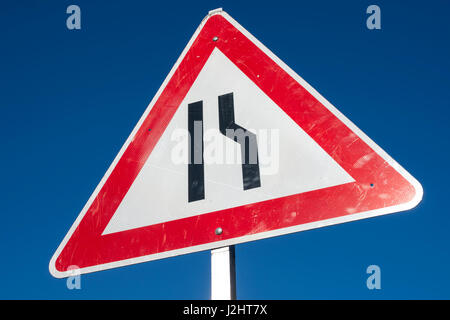 German road sign: road narrows, both sides, narrow, bottleneck, construction site, roadworks, warning, triangular Stock Photo