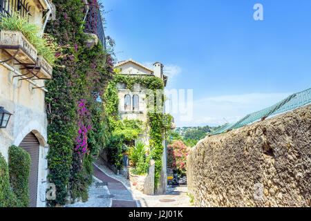 Vine covered homes along ancient street in St. Paul de Vence, Provence, France Stock Photo