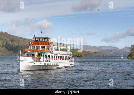 On a sunny, spring day, the pleasure boat 'Teal' cruises on Lake Windermere, Lake district, Cumbria, England, Britain. Stock Photo