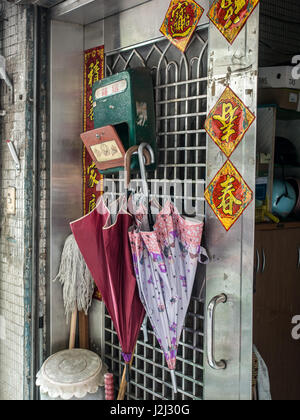 Taipei, Taiwan - October 08, 2016: Green mailbox with Chinese titles and umbrellas Stock Photo