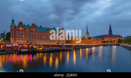 Night panoramic view on Christiansborg Palace and Slotsholmen over the canal in Copenhagen, Denmark.