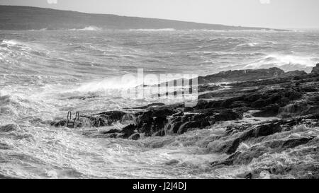 Black and white: Rough seas captured in Hondoq ir Rummien, Gozo during the stormy weekend of the 18th of December, 2016. Stock Photo