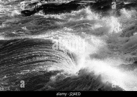 Black and white: Rough seas captured in Hondoq ir Rummien, Gozo during the stormy weekend of the 18th of December, 2016. Stock Photo