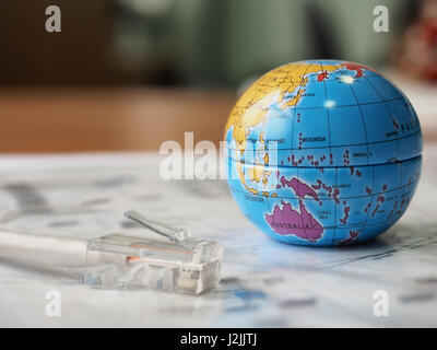 Globe with internet cable. Network in Australia Stock Photo