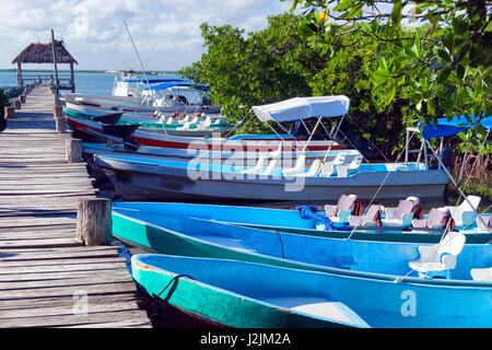 Boats lined up along a pier in Punta Allen near Tulum, Mexico Stock Photo