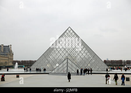 The Louvre Pyramid (Pyramide du Louvre) is a large glass and metal pyramid, designed by I. M. Pei, in the main courtyard of the Louvre Museum, Paris Stock Photo