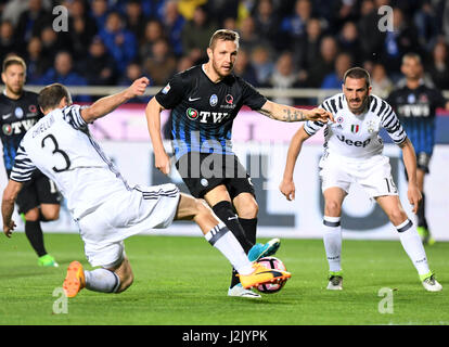 Bergamo. 29th Apr, 2017. Atalanta's Jasmin Kurtic (C) vies with Juventus's Giorgio Chiellini (L) and Leonardo Bonucci during a Serie A soccer match between Juventus and Atalanta at 'Atleti Azzurri D'Italia' stadium in Bergamo, Italy, April. 28, 2017. The match ended with a 2-2 draw. Credit: Alberto Lingria/Xinhua/Alamy Live News Stock Photo