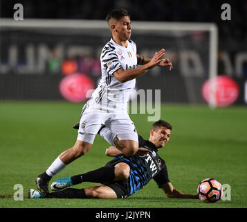 Bergamo. 29th Apr, 2017. Juventus's Paulo Dybala (L) vies with Atalanta's Remo Freuler during a Serie A soccer match between Juventus and Atalanta at 'Atleti Azzurri D'Italia' stadium in Bergamo, Italy, April. 28, 2017. The match ended with a 2-2 draw. Credit: Alberto Lingria/Xinhua/Alamy Live News Stock Photo