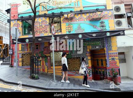 Hong Kong, China. 28th Apr, 2017. Tourists tour a street in Central, Hong Kong, south China, April 28, 2017. Credit: Li Peng/Xinhua/Alamy Live News Stock Photo