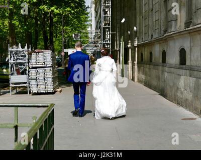 Paris, France, 29 April, 2017. Bridal couple leaves the Mairie (City Hall) in the 11th Arrondissement where local, civil marriage ceremonies take place. Credit: Cecile Marion/Alamy Live News Stock Photo