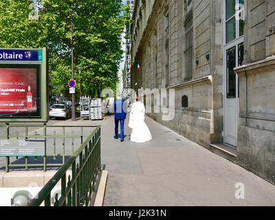 Paris, France, 29 April, 2017. Bridal couple leaves the Mairie (City Hall) in the 11th Arrondissement where local, civil marriage ceremonies take place. Credit: Cecile Marion/Alamy Live News Stock Photo