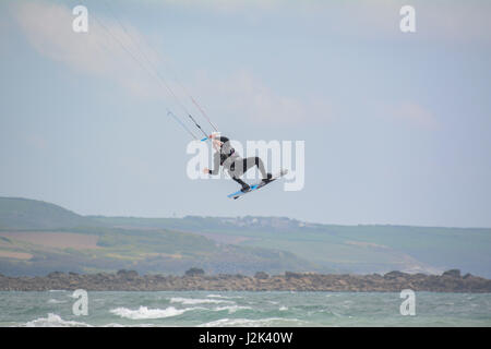 Marazion, Cornwall, UK. 29th Apr, 2017. UK Weather. A sunny but breezy afternoon for the May bank holiday Saturday. Ideal conditions for kitesurfing. Credit: Simon Maycock/Alamy Live News Stock Photo