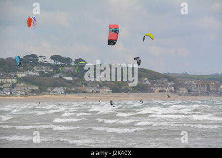 Marazion, Cornwall, UK. 29th Apr, 2017. UK Weather. A sunny but breezy afternoon for the May bank holiday Saturday. Ideal conditions for kitesurfing. Credit: Simon Maycock/Alamy Live News Stock Photo