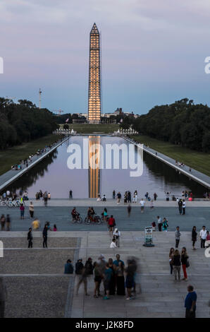 Washington DC, USA - August 15, 2013: Washington Monument and people by Lincoln Memorial and reflecting pool on national mall with construction during Stock Photo